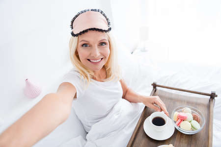 Self-portrait of nice attractive lovely pretty cute glad cheerful woman mother mom having breakfast...