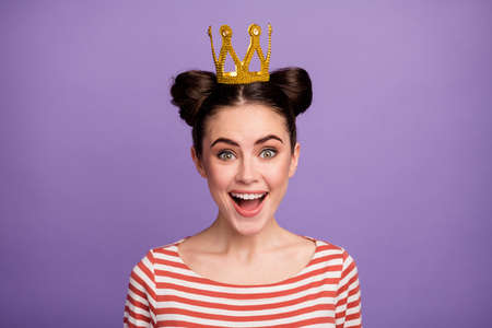 Closeup photo of pretty teenager lady students prom queen enjoy people choice satisfied wear golden crown white red casual striped shirt isolated pastel purple color backgroundの写真素材
