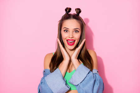 Photo of pretty funky lady listen cool news open mouth arms near cheekbones good mood wear denim...