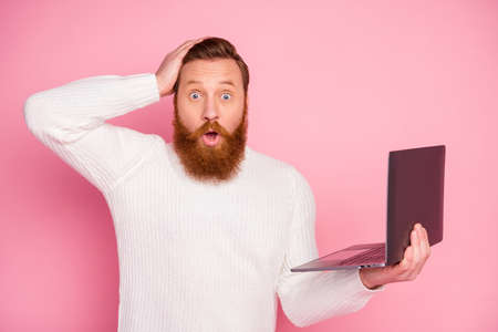 Portrait of astonished guy work on computer search incredible discounts impressed feel stupor stare...