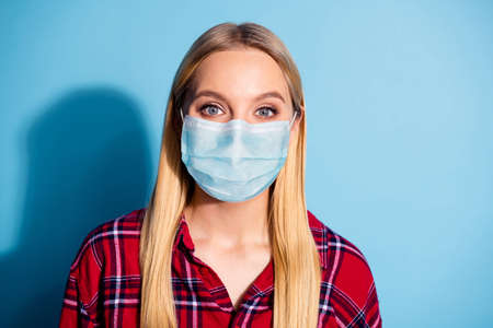 Close up photo of nice stunning funny millennial stay home covid-19 quarantine, good-looking medical mask isolated dressed in plaid outfit on colorful backgroundの写真素材