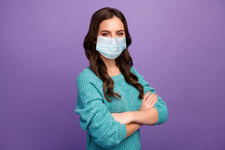 Portrait of her she nice attractive content healthy wavy-haired girl wearing mask social discipline self isolation disease prevention isolated bright vivid shine vibrant violet color backgroundの写真素材