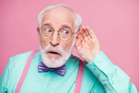 Closeup photo of attractive grandpa hand near ear listen rumors focused chatterbox bad person wear...