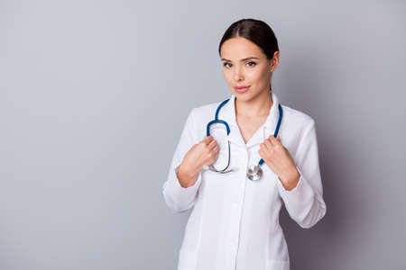 Photo of attractive positive family doc experienced skilled professional listen patient complaining good mood friendly look wear medical uniform lab coat stethoscope isolated grey backgroundの写真素材