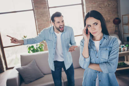 Portrait of annoyed disappointed woman have scandal with husband scream yell she touch hands head news comfort cozy couch sofa in house indoorsの写真素材