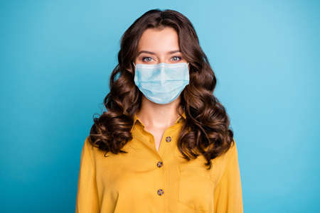 Close-up portrait of her she nice attractive wavy-haired girl wearing reusable gauze mask mers cov...