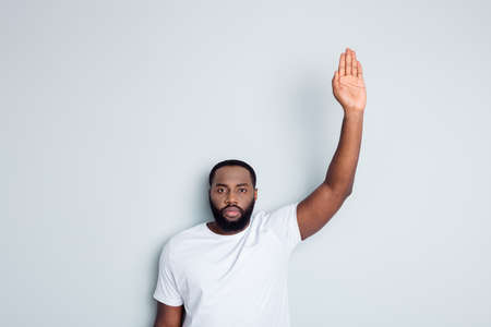 Photo of serious dark skin african protester community group volunteer raise arm stand against black citizens lawlessness wish stop police murder people concept isolated grey color backgroundの写真素材
