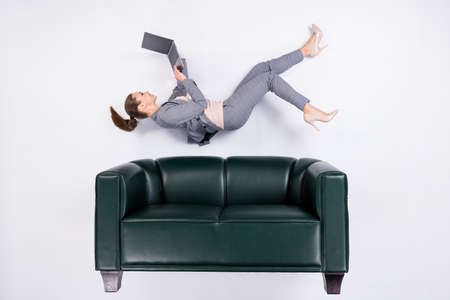 Top above high angle view full size profile side photo of marketer girl work laptop, typing chatting boss flat lay leather divan wear high heels stilettos isolated white color backgroundの写真素材