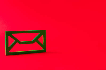 Close-up view of green mailbox figure connecting people worldwide net work corporate contact isolated over bright vivid shine vibrant red color backgroundの写真素材