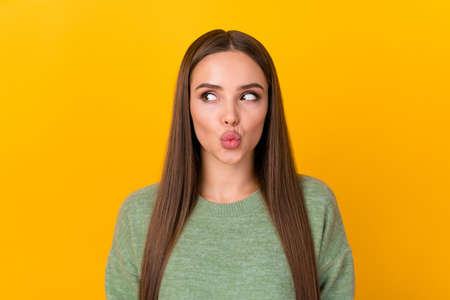Portrait of pretty lovely lady want attract handsome guy on 14-february holiday look copyspace send air kiss wear jumper isolated over bright color backgroundの写真素材
