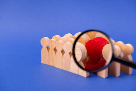 Loupe lens enlarging viewing looking for new candidate cv resume, talent wooden figures choosing...