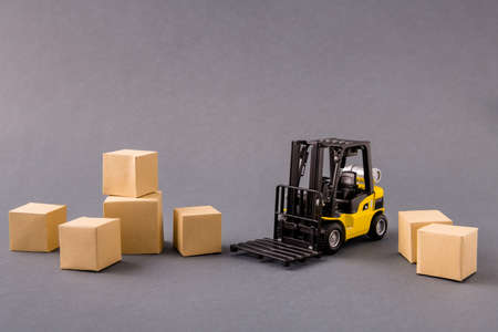 Photo of small electric vehicle loader bringing delivering stuff buyings big large, boxes fast...