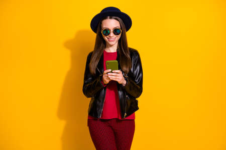 Portrait of nice attractive lovely pretty cheerful cheery straight-haired girl using 5g digital...