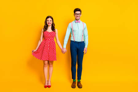 Full size photo of nice charming couple girl geek stylish hold hand wear stylish skirt stilettos blue shirt green trendy style socks pants trousers isolated over bright shine color backgroundの写真素材