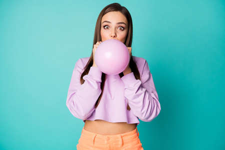 Photo of funky crazy lady blowing air balloon preparing decorations for birthday party wear cropped...