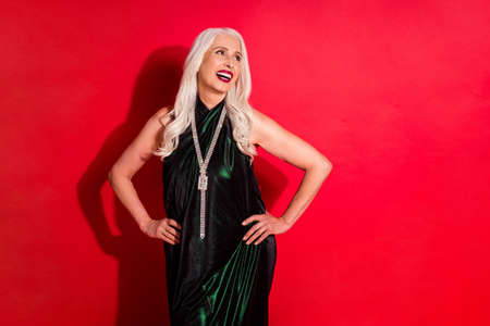 Photo of attractive aged grey haired lady good mood luxury evening makeup arms by sides...