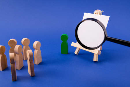 Wooden figures of pupils students listening to presenter professor in classroom class loupe enlarging image copyspace isolated over bright vivid shine vibrant blue color backgroundの写真素材