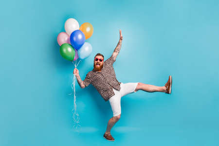 Full size photo of crazy luxury person guy hold many colorful air balloons festive event party raise...