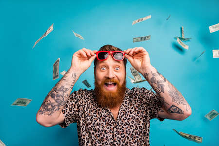 Photo of excited emotional macho guy luxury rich person dollars fall from sky income lottery...
