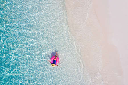 Top above high angle aerial drone view of her she attractive girl rich chic lady floating on rubber...