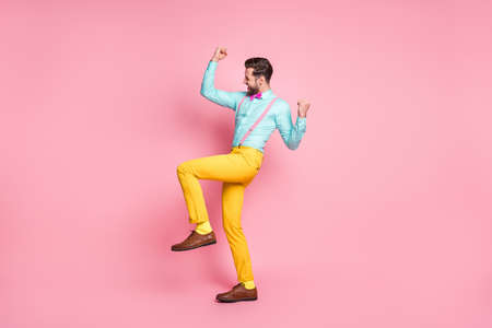 Full length body size view of his he nice attractive glad successful cheerful cheery bearded guy rejoicing dancing celebrating having fun isolated over pink pastel color backgroundの写真素材