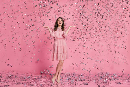 Full size photo of astonished positive cheerful cute pretty charming girl enjoy impressed air fly...