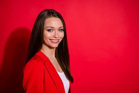 Closeup profile photo of attractive business lady successful person worker self-confident cheerful boss chief wear luxury office blazer suit white shirt isolated vibrant red color backgroundの写真素材