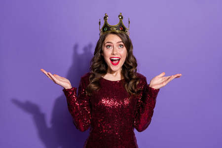 Photo of attractive crazy lady festive party prom queen nomination excited crown on head overjoyed raise hands wear sequins burgundy short dress isolated pastel violet color backgroundの写真素材