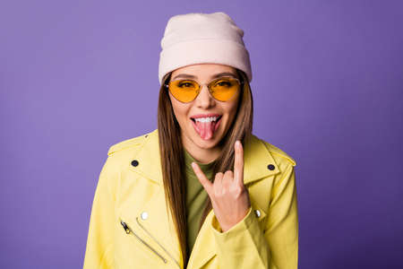 Close-up portrait of her she nice attractive cool lovely cheerful cheery girl punk showing horn sign...