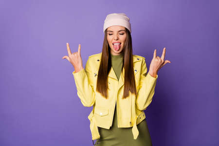 Photo of funky crazy lady showing hands horns metal music lover protruding tongue out mouth wear...