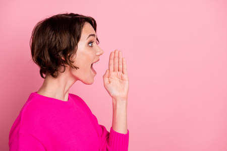 Profile photo of pretty excited funny lady hold palm arm hand near open mouth speaking loud tell say...