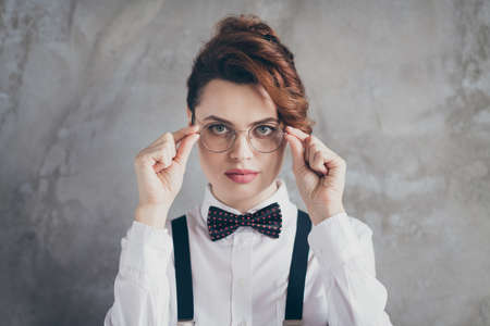 Close-up portrait of nice-looking attractive content serious intellectual wavy-haired girl...