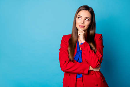 Close-up portrait of her she nice-looking attractive lovely pretty charming gorgeous creative lady top manager overthinking isolated over bright vivid shine vibrant blue green color backgroundの写真素材