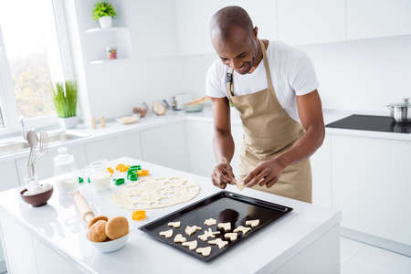 Portrait of his he nice attractive cheerful guy boyfriend preparing romantic surprise handmade snack...