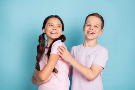 Photo of positive cheerful two kids boy girl happy family concept wear good look clothes isolated...
