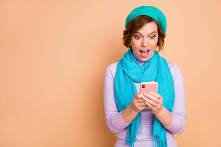 Close-up portrait of her she nice attractive lovely amazed cheerful cheery addicted girl using cell...