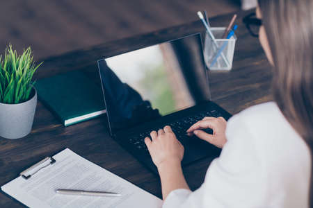 Close-up profile side view portrait of her she skilled focused busy lady experienced copywriter stay home-based quarantine study learn courses classes at modern wooden interior workplace workstationの写真素材