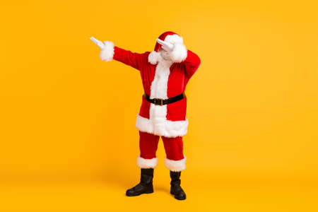 Full length body size view of nice funny positive thick fat white-haired Santa St Nicholas dancing having fun Eve Noel night isolated bright vivid shine vibrant yellow color backgroundの写真素材