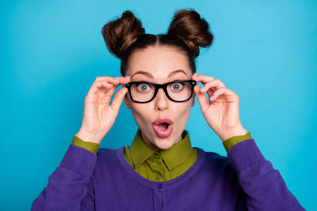 Close-up portrait of her she nice attractive funny amazed cheerful cheery brown-haired schoolgirl pout lips reaction isolated on bright vivid shine vibrant blue green teal turquoise color backgroundの写真素材