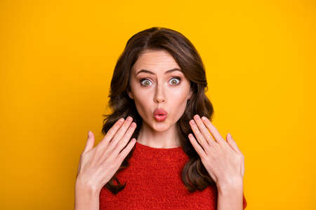 Close-up portrait of her she nice attractive lovely pretty funny cute lucky cheerful cheery wavy-haired girl win news reaction pout lips isolated on bright vivid shine vibrant yellow color backgroundの写真素材