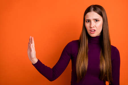 Photo of frustrated upset girl hold hand copyspace reject stop bad disgust spoiled smell wear jumper...