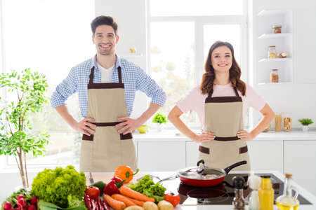 Portrait of positive friendship spouses put hands waist confident ready cook tasty delicious meal...
