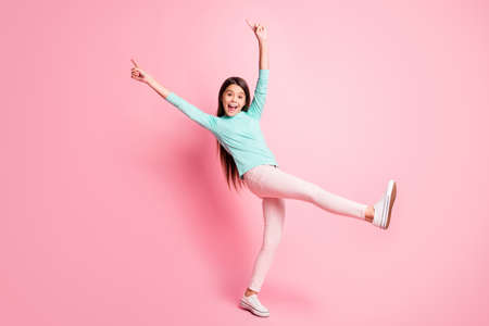 Full body size photo of cute pretty little hispanic lady long hairstyle dance raise hands up direct...