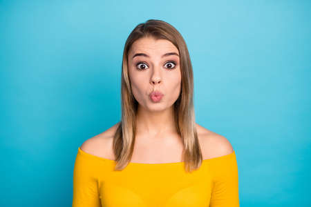 Close-up portrait of her she nice attractive lovely charming pretty cute lovable cheery amazed girl sending air kiss isolated over bright vivid shine vibrant blue color backgroundの写真素材