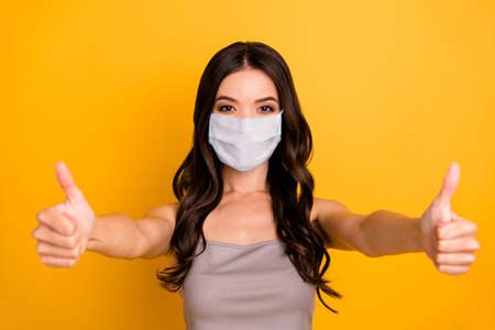 Photo of cheerful positive cute pretty girlfriend wearing white medical mas express great alright...