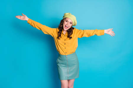 Photo of candid lovely girl open hands want hug embrace her friend isolated over blue color backgroundの写真素材
