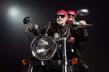 Photo of two cool old bikers white hair man lady couple drive vintage chopper traveling together...