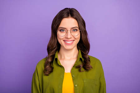 Portrait of smart reliable girl have eyewear look in camera wear casual style cool modern clothes isolated over vivid purple color backgroundの写真素材