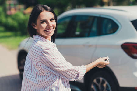 Profile side view portrait of her she nice attractive lovely cheerful cheery lady driver pressing...