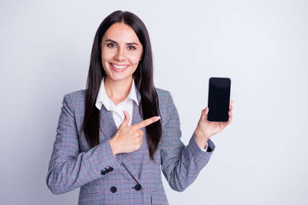 Photo of attractive business lady hold telephone gadget device app directing finger sensor screen...